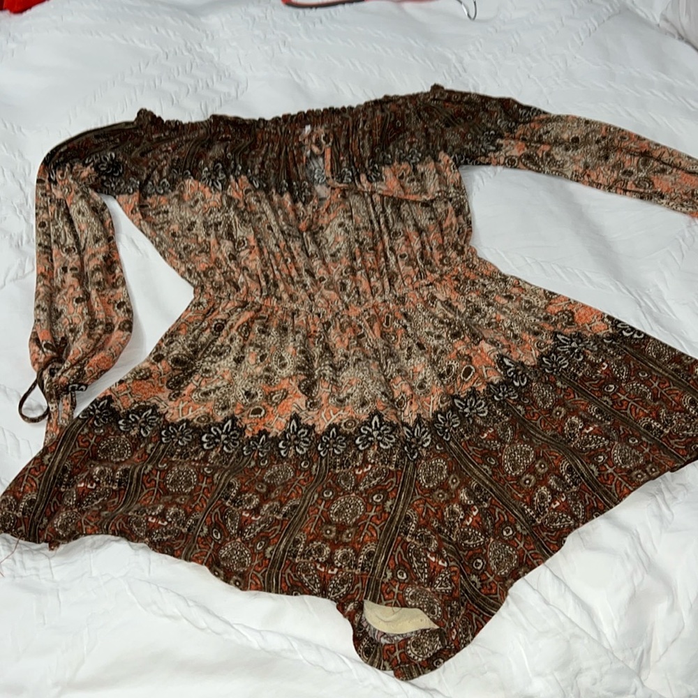 Free People Bohemian Long Sleeve Romper with cut out sleeves.